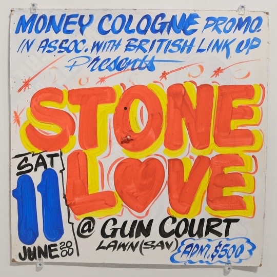 A Stone Love sign in red and orange on a white board