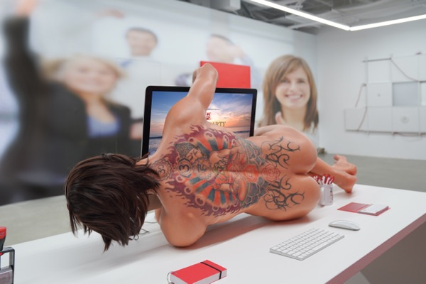A lifelike sculpture of a tattooed nude figure lying face down across an office desk, in front of a large photo of smiling office workers