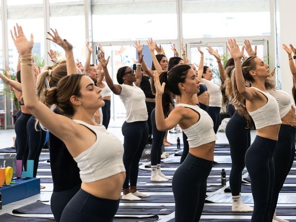 A movement class with arms raised