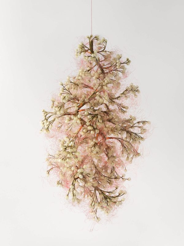 LIGHT_01 by Lærke Lillelund: a suspended cluster of pale pink and cream textile blossoms hanging from a fine line against a white wall